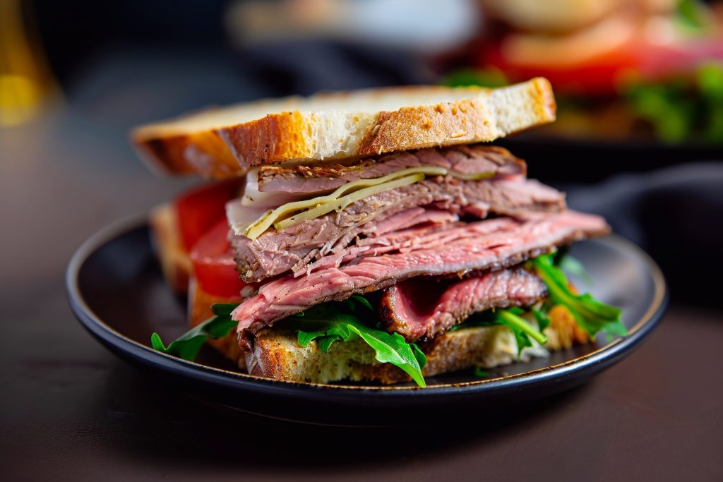 Roast beef fresh sandwich with salad and tomatoes on cafe table suitable for lunch.AI Generative.